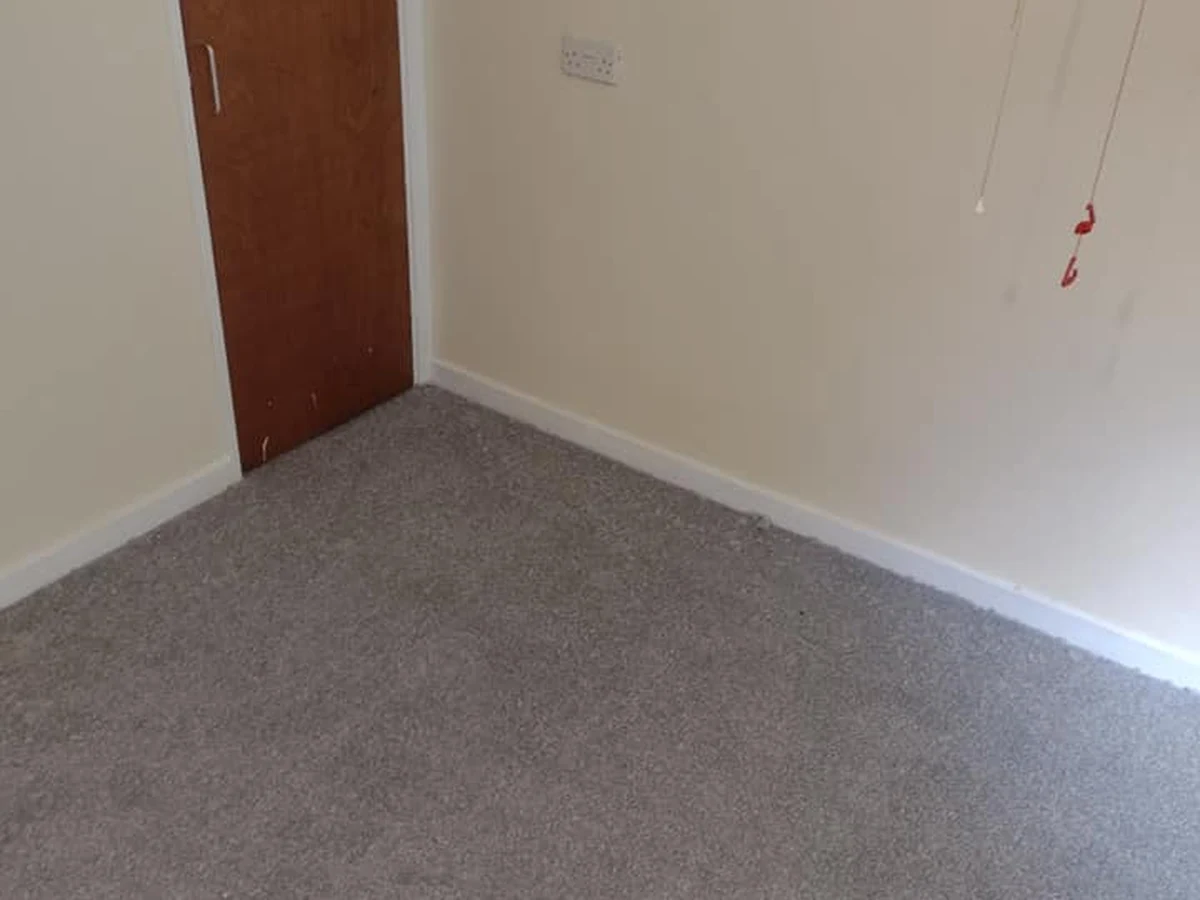 Grey carpet fitted in a bedroom with oak door, Newcastle