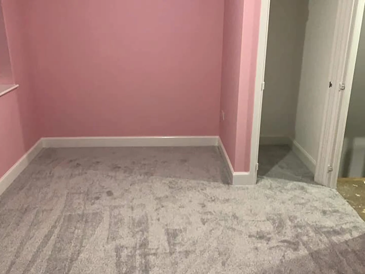 Silver carpet in a pink-walled bedroom, Newcastle