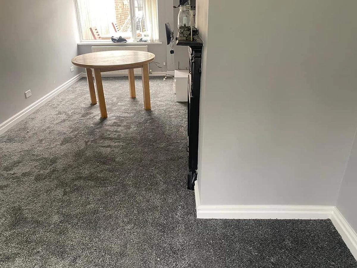 Grey living room carpet fitted around the furniture, Newcastle
