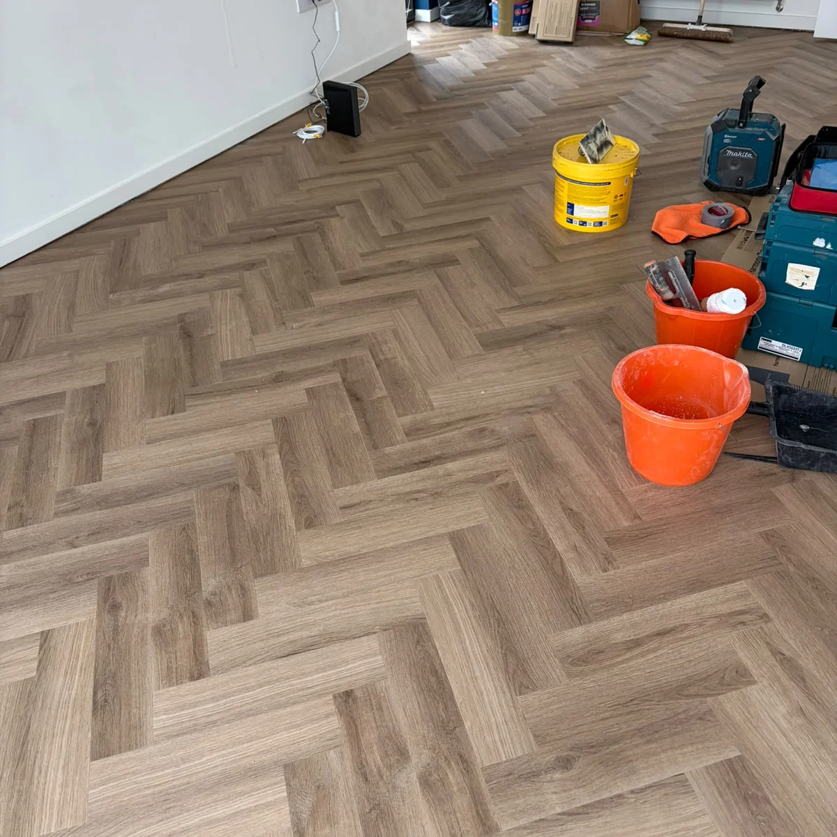 lvt-fitting-in-progress-newcastle-foxglove-flooring Herringbone LVT floor being fitted, Newcastle